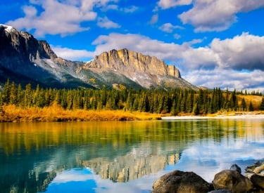 river with mountains in the background